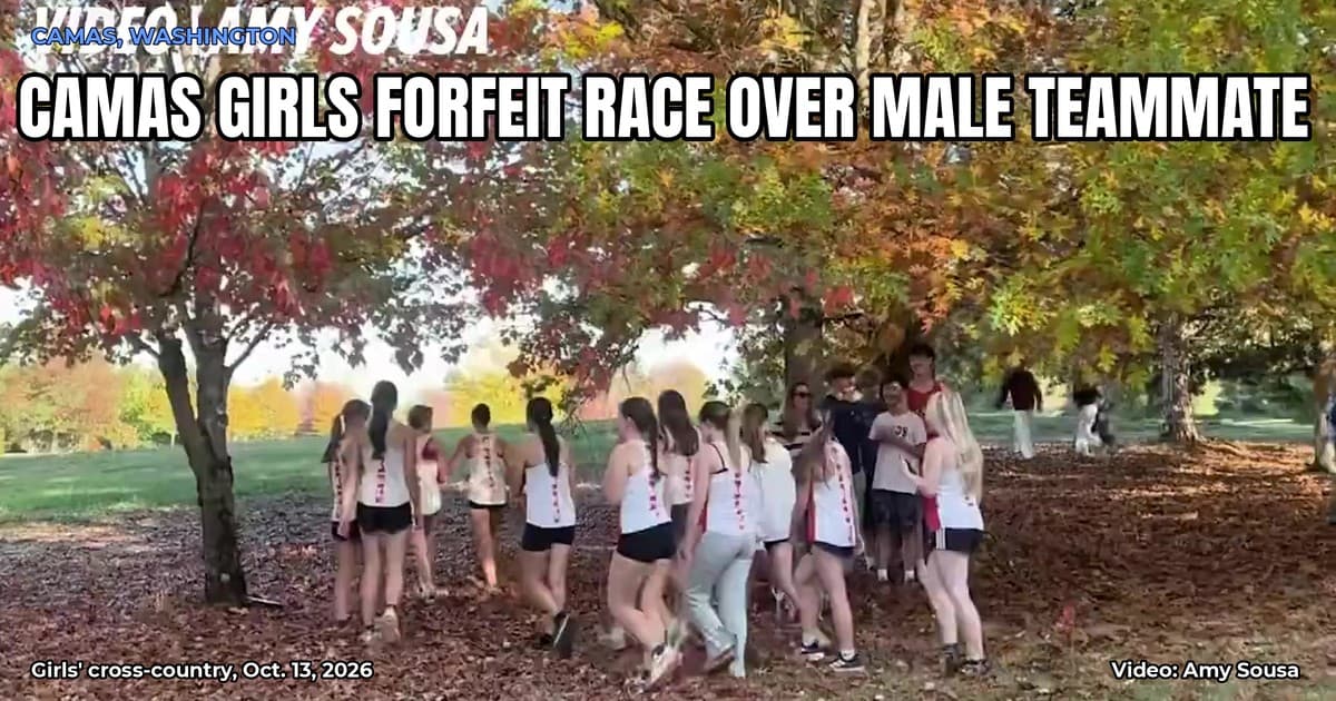 Camas High girls' cross-country runners in team uniforms walk together under autumn trees after forfeiting a race